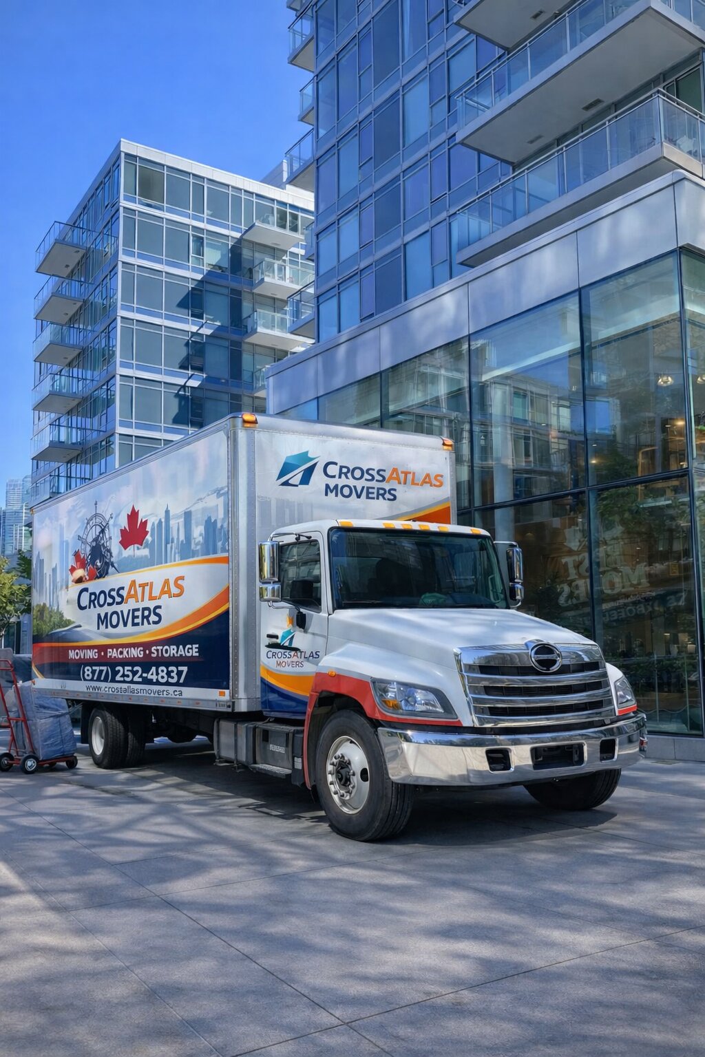 Professional moving truck parked near a high-rise residential building during a condo relocation