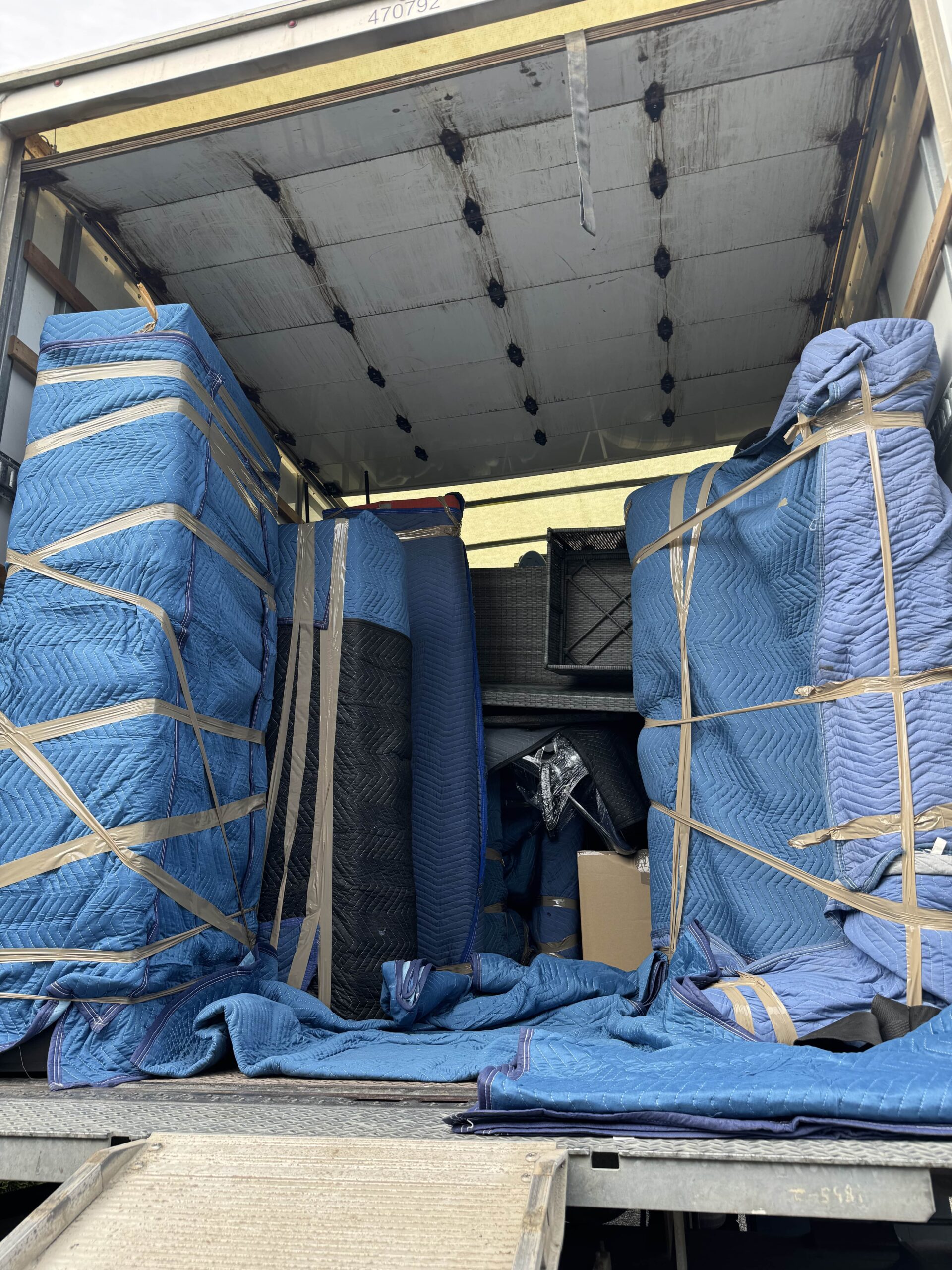 Secure long-distance moving truck transporting household belongings from Vancouver to Red Deer across provincial routes