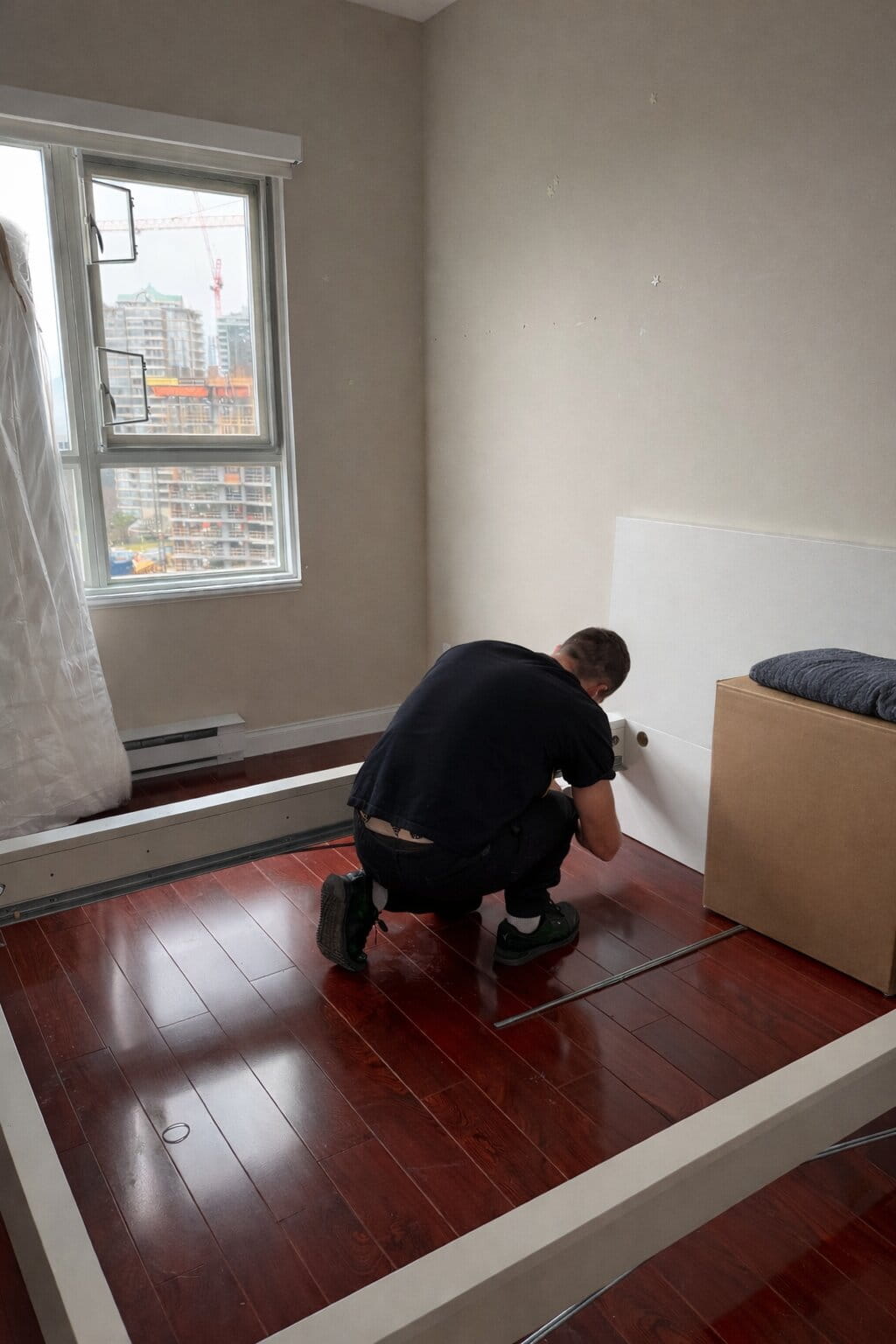 mover assembling bed frame during long distance move in Edmonton apartment